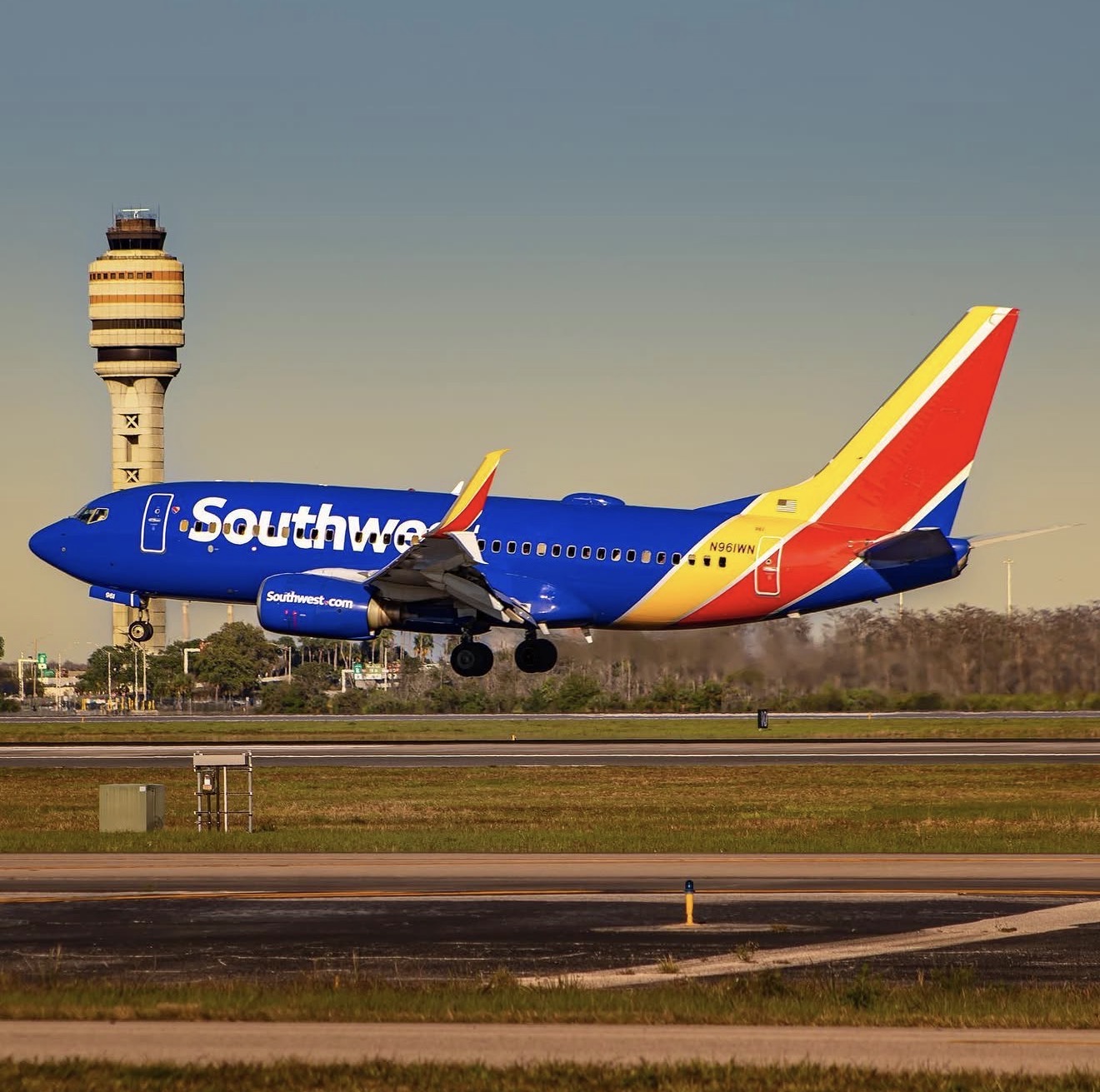 Southwest Airlines Boeing 737-700 taking off with MCO ATC tower
