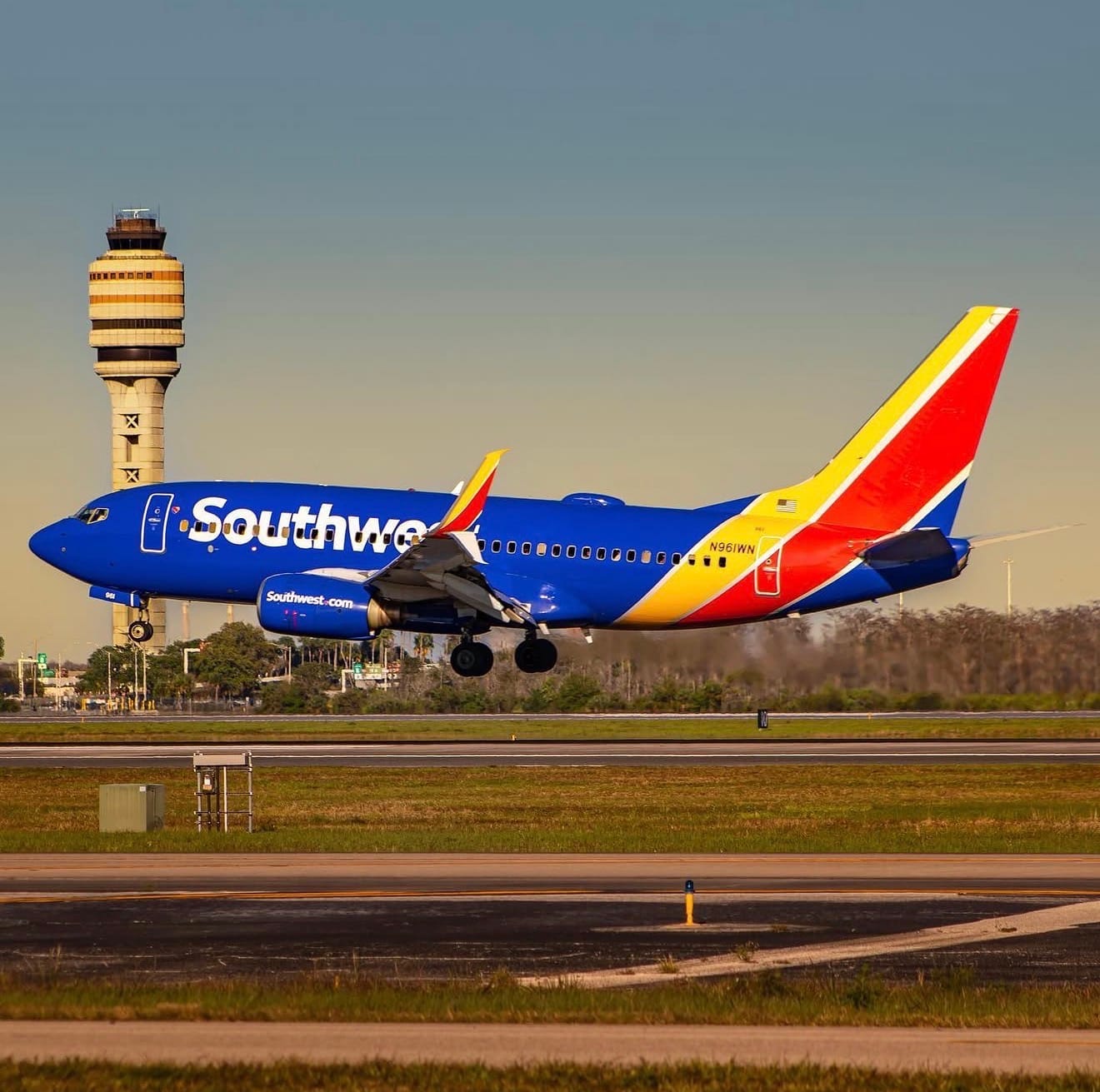 Southwest Airlines Boeing 737-700 taking off with MCO ATC tower