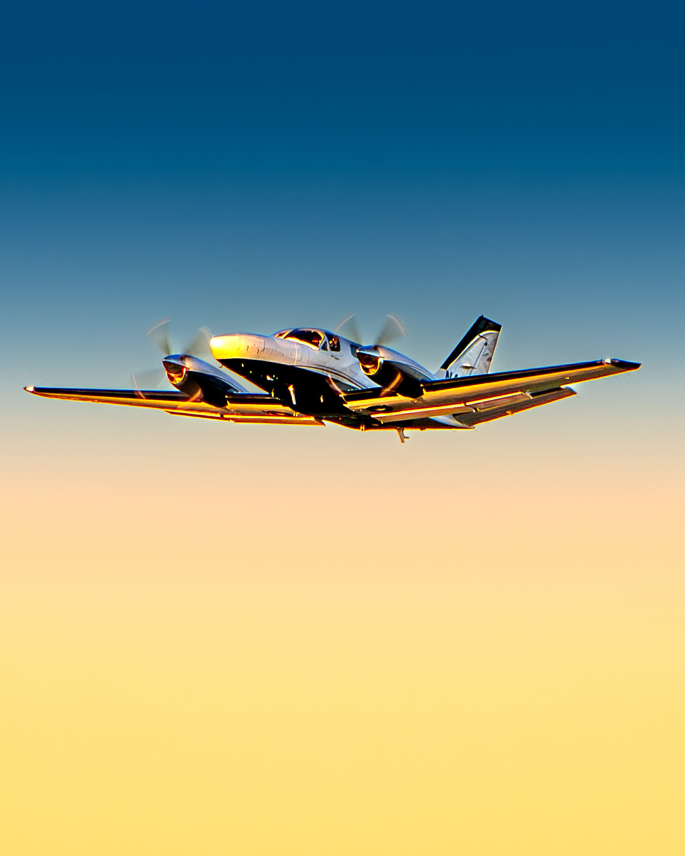 Twin-engine aircraft at golden hour