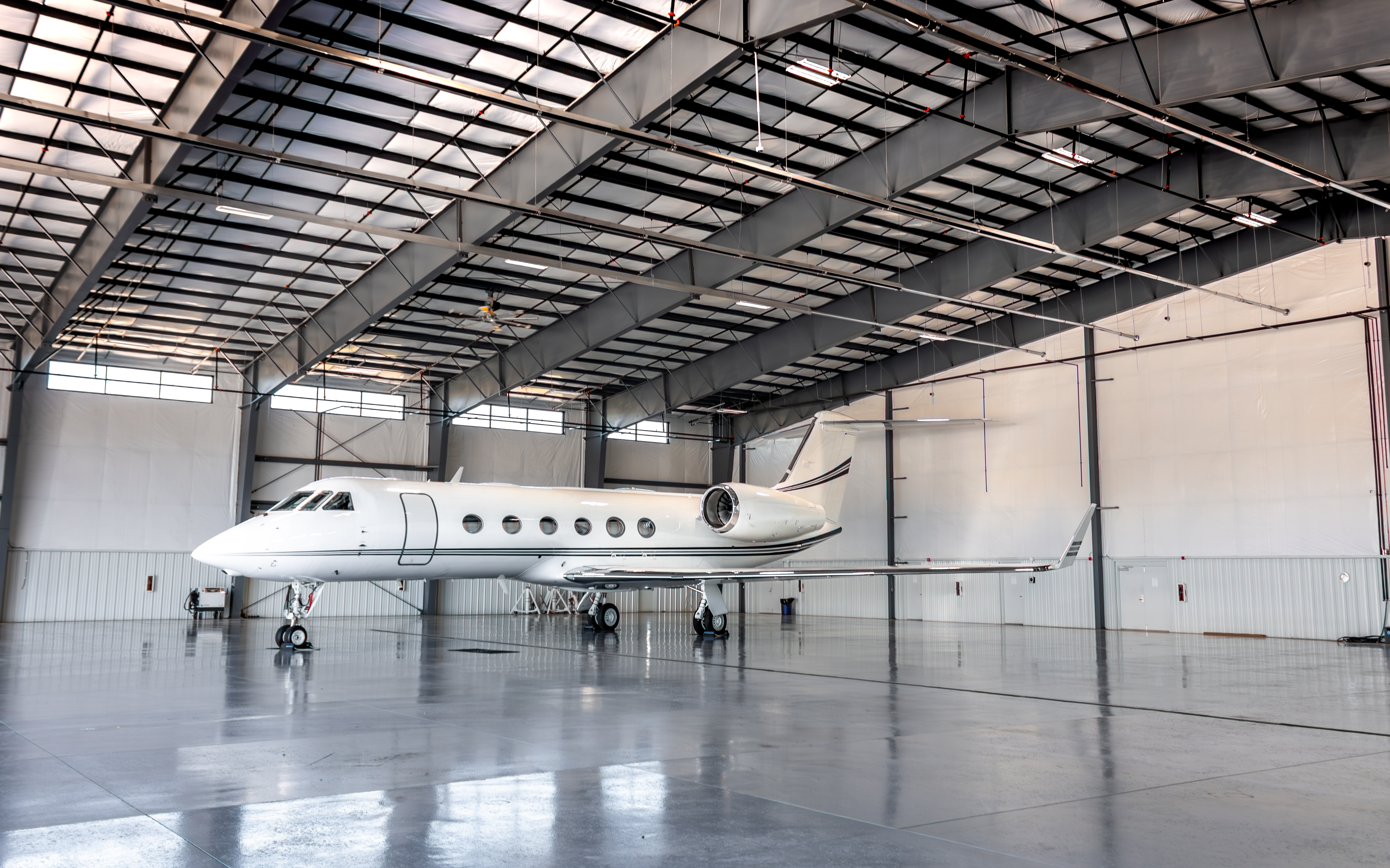 Large-cabin jet in hangar