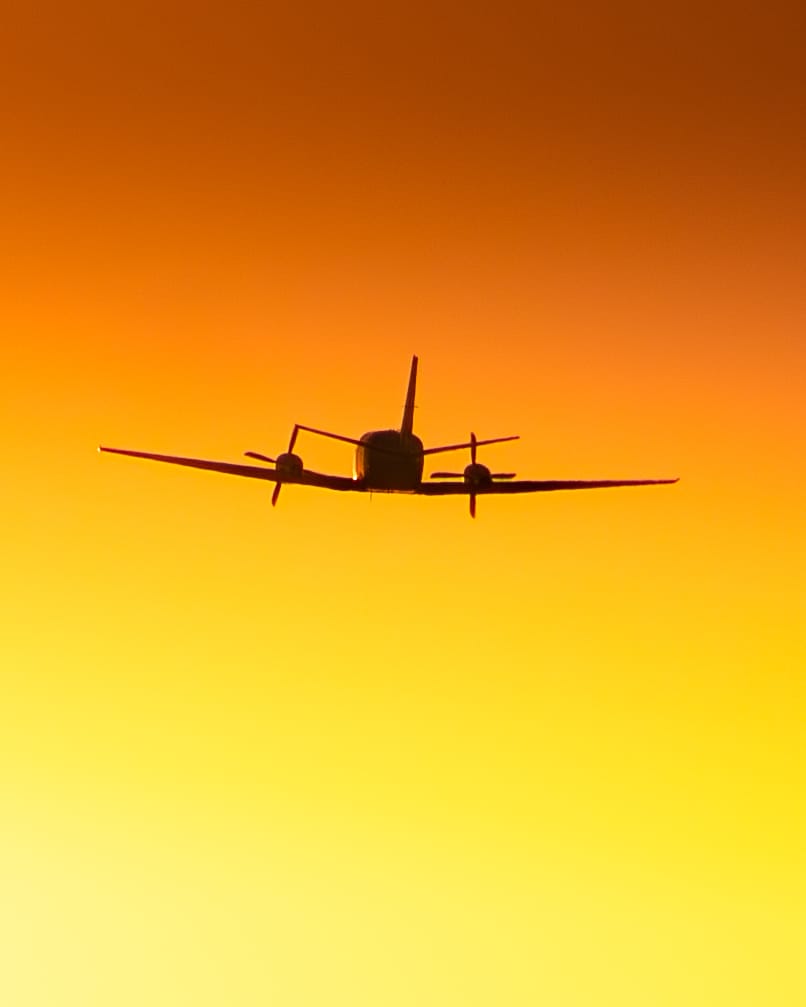 Aircraft silhouette at sunrise